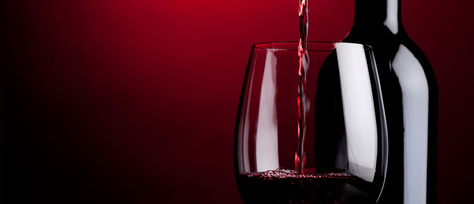 Red wine being poured into a glass